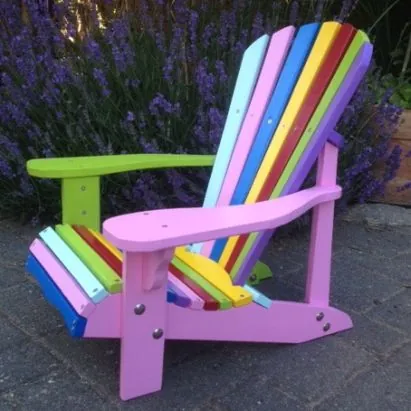 Adirondack chair with each slat painted a different bright colour and a pink frame