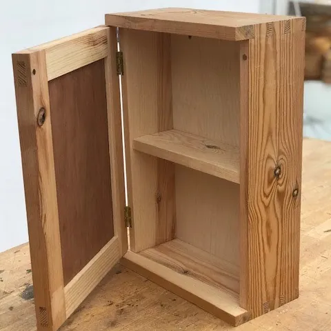 Small pine wall cabinet with dovetail corners, open panel door and one shelf